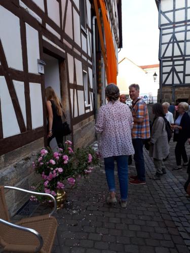 a group of people standing outside of a building at Monteurs-Ferienwohnung in Wolfhagen