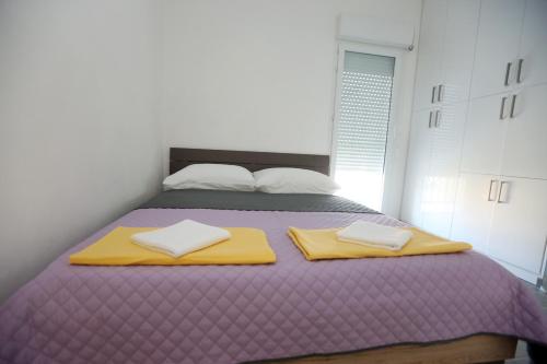 Ένα ή περισσότερα κρεβάτια σε δωμάτιο στο Apartmani Ivan V RELAX