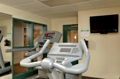 a row of cardio machines in a gym at Lancaster Inn & Suites in Manheim