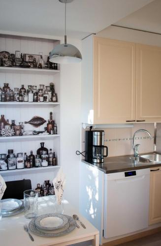 a kitchen with a table with a plate on it at Kotiyksiö Alex in Lahti