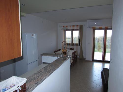 a kitchen with a sink and a counter top at Apartments Goga in Umag