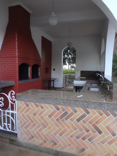Ein Sitzbereich in der Unterkunft Carlton Suítes Limeira
