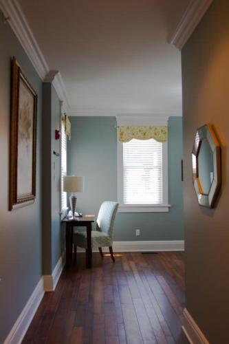 a room with a table and a chair and a window at Wishmaker House B&b in Bellville