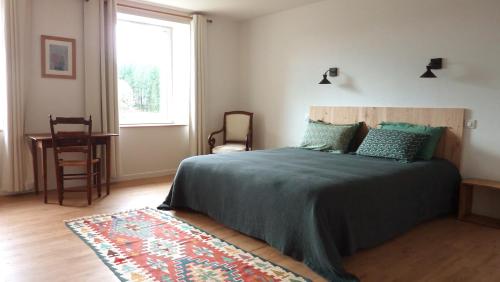 Postel nebo postele na pokoji v ubytování Chambre d'hôtes Chalendeix