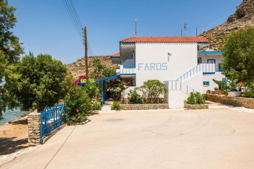 a white building with the word france on it at Faros Rooms in Livadia
