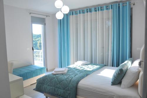 Ένα ή περισσότερα κρεβάτια σε δωμάτιο στο Apartments Ambassador