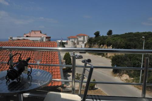 a bag sitting on a glass table on a balcony at Ambassador & Ambassador Lux Apartments in Ulcinj