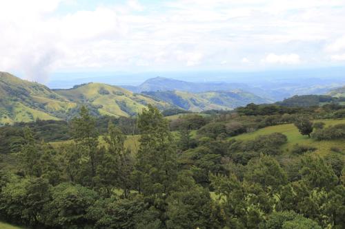 an aerial view of a valley with hills and trees at Hotel Bosque Verde Lodge in Monteverde Costa Rica