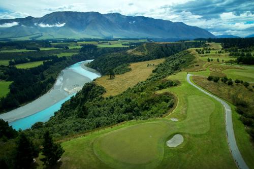 an aerial view of a golf course next to a river at Fable Terrace Downs Resort by MGallery in Windwhistle