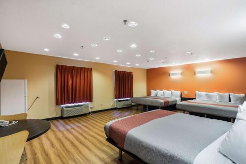a hotel room with two beds and a chalk board at Motel 6-Libertyville, IL in Libertyville