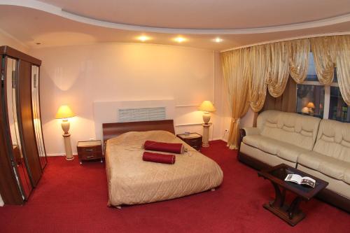 En eller flere senge i et værelse på Hotel Dauria