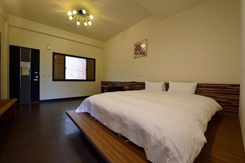 Postel nebo postele na pokoji v ubytování Shan Jhong You You B&B