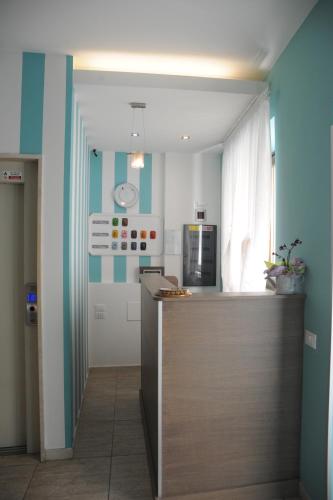 a kitchen with a counter top in a room at GG8 Hotel & Suite SPA in Gualdo Tadino