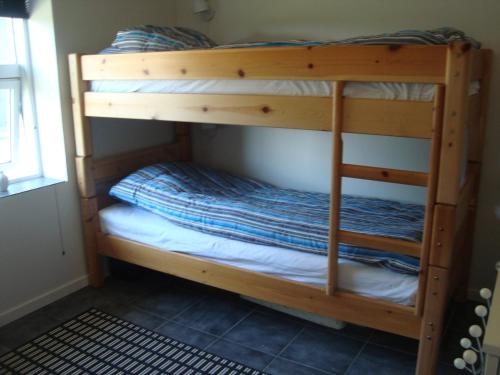 Uma ou mais camas em beliche em um quarto em Thorupgaard Farm Holiday