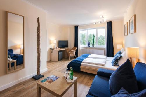 Katil atau katil-katil dalam bilik di Das Frühstückshotel Sankt Peter-Ording