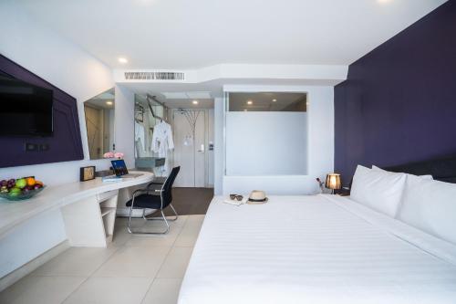 Katil atau katil-katil dalam bilik di Blue Boat Hotel JC