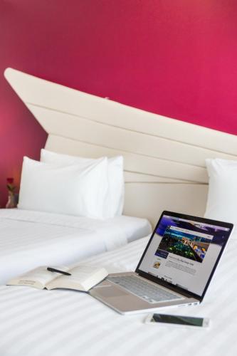 Katil atau katil-katil dalam bilik di Blue Boat Hotel JC