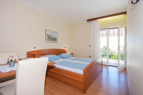 Ένα ή περισσότερα κρεβάτια σε δωμάτιο στο Villa Daniela