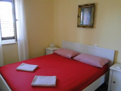 Postel nebo postele na pokoji v ubytování Apartment Pino