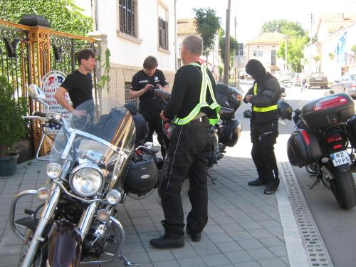 a police officer standing next to a group of motorcycles at Base for Adventurers - Urban Guerrilla in Negotin