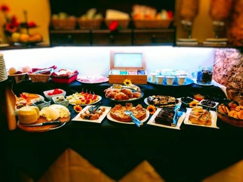 a table topped with lots of different types of food at Locanda Scirocco in Castellammare del Golfo
