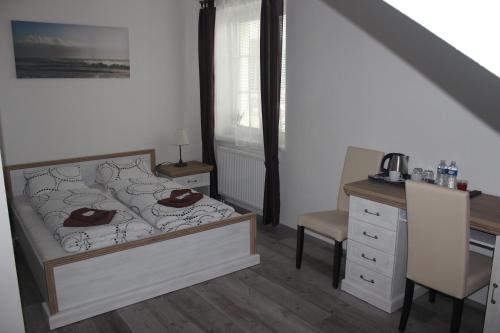 Rúm í herbergi á Penzion Vesely