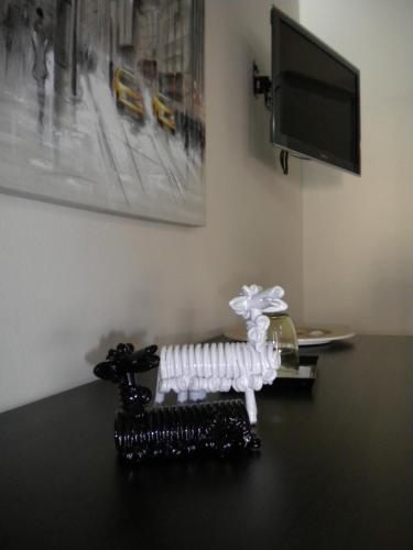 a skeleton sitting on a table next to a tv at B&B Martina in Assemini