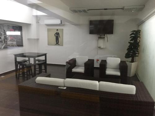a living room with a couch and a table at Marbella Juan Dolio in Juan Dolio