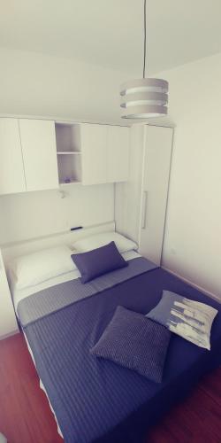 Кровать или кровати в номере APARTMAN ERCEGOVIĆ