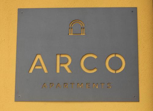 a sign for the entrance to aacocrap organisations at Arco Apartments in Porto