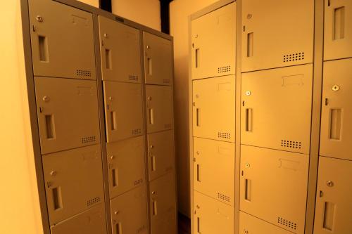 a row of lockers in a locker room at Krit Hostel in Bangkok
