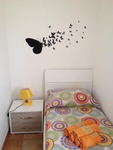 Posteľ alebo postele v izbe v ubytovaní Casa vacanza Nonna Sarina