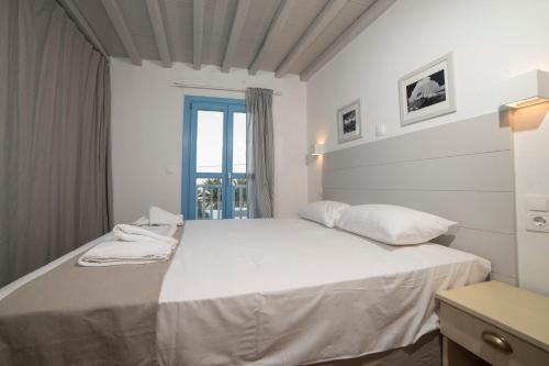 Ένα ή περισσότερα κρεβάτια σε δωμάτιο στο Almyra Guesthouse