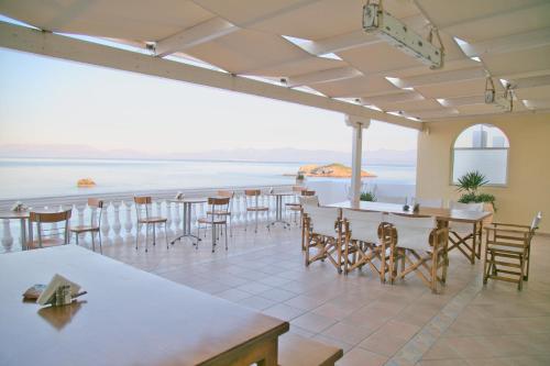 a restaurant with a view of the ocean at Elea Mare in Elia Laconias