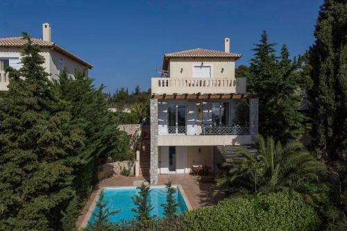 an aerial view of a house with a swimming pool at Porto Heli Villa in Porto Heli