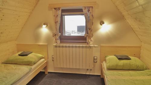 Posteľ alebo postele v izbe v ubytovaní Horský apartmán Draps