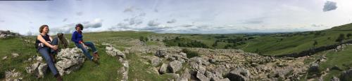 two people sitting on top of a mountain at Inglenook Guest House in Ingleton 