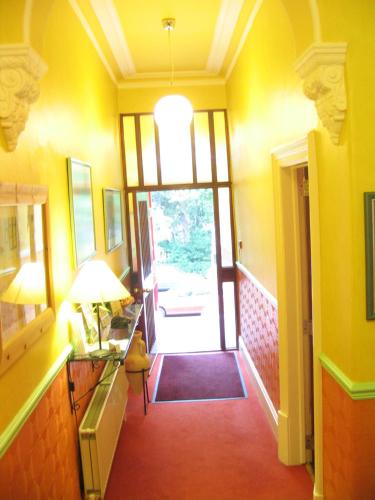 a hallway with a door leading into a room at The Dales in Harrogate