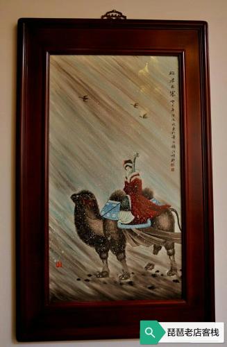 a painting of a man riding a horse at Pipa Hotel Datong in Datong