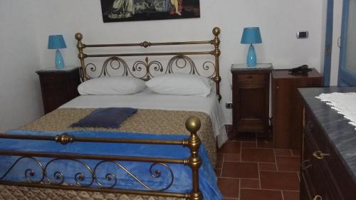 a bedroom with a bed and two night stands and two lamps at B&b Lemon Garden in Sciacca