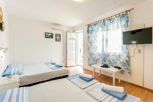 Кровать или кровати в номере Apartments Nadja