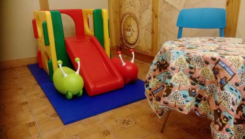 a childrens play room with a table and chairs at Bear Homestay in Taitung City