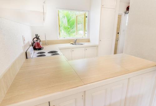 a kitchen with a counter top with a tea kettle on it at 230 GG Rockley Barbados in Bridgetown