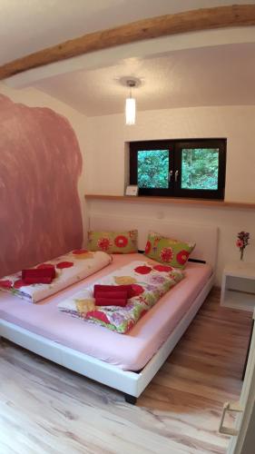 a bedroom with a large bed in a room at Das Haus am Hang in Schwäbisch Hall