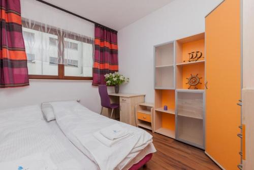 Posteľ alebo postele v izbe v ubytovaní Apartamenty Platan