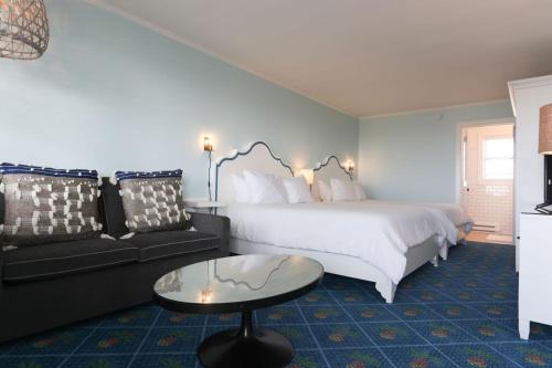 a hotel room with a bed and a couch at Beach Shack in Cape May