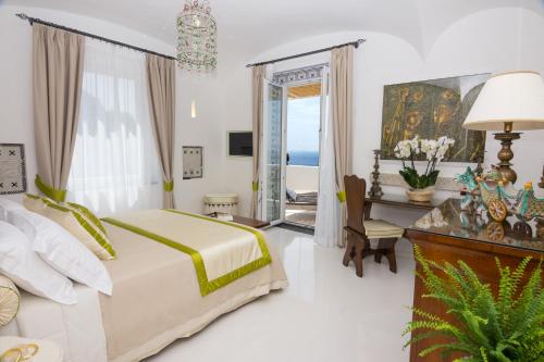 En eller flere senger på et rom på Villa Pietra Santa