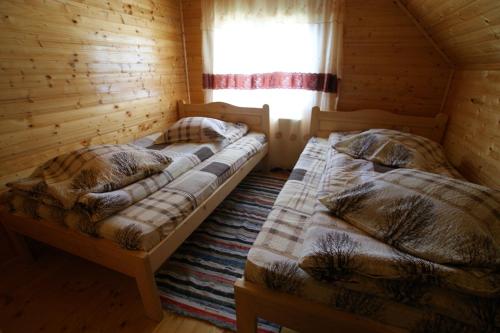 A bed or beds in a room at Cabana Ioana