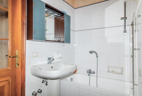 a bathroom with a sink and a shower at L' Arnia in Ome