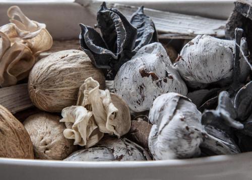 a white bowl filled with lots of mushrooms at Auld Leigh-Lann Apartments in Anstruther